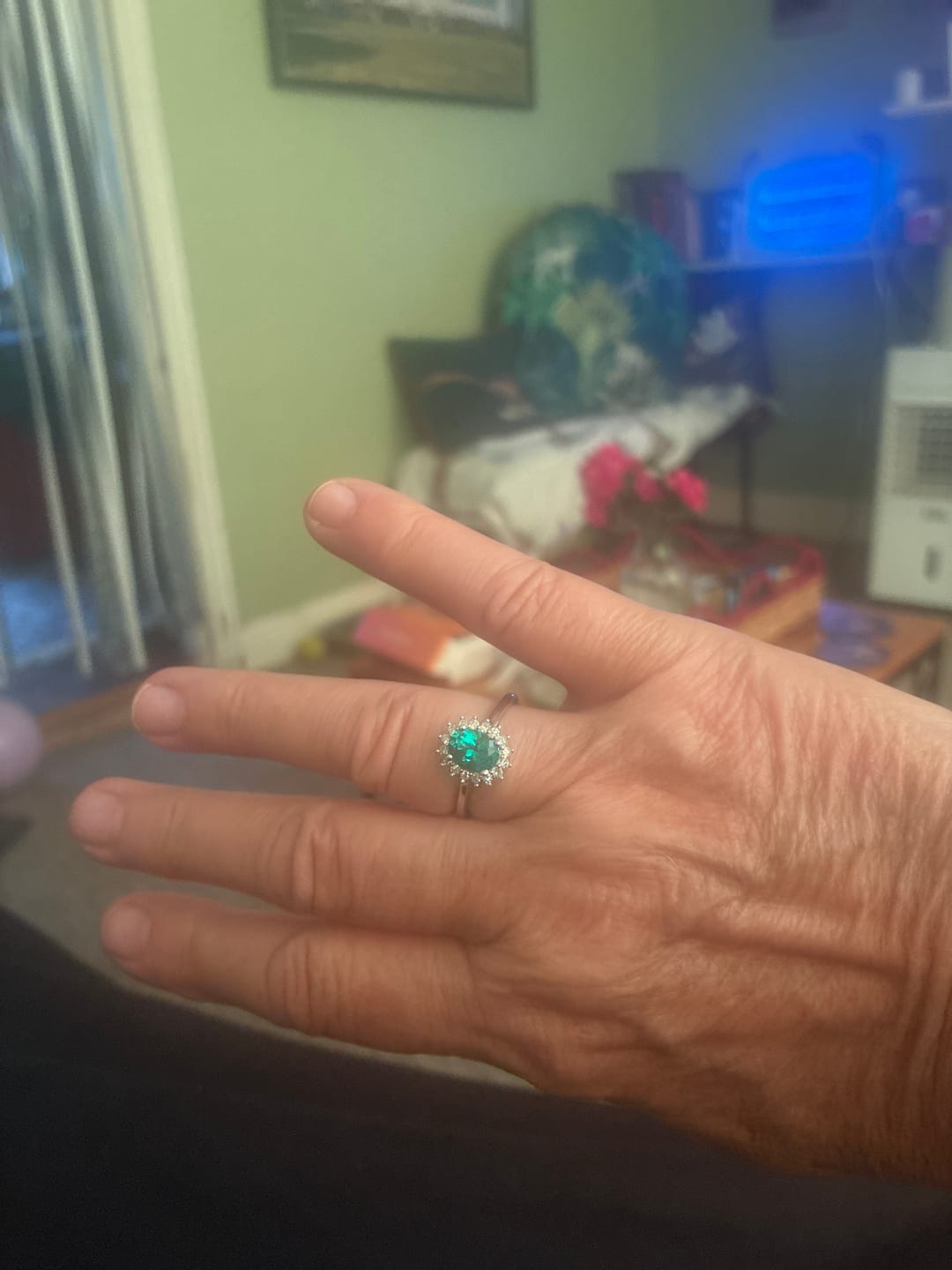 Customer photo review of Oval Emerald Diamond Sunburst Halo Ring