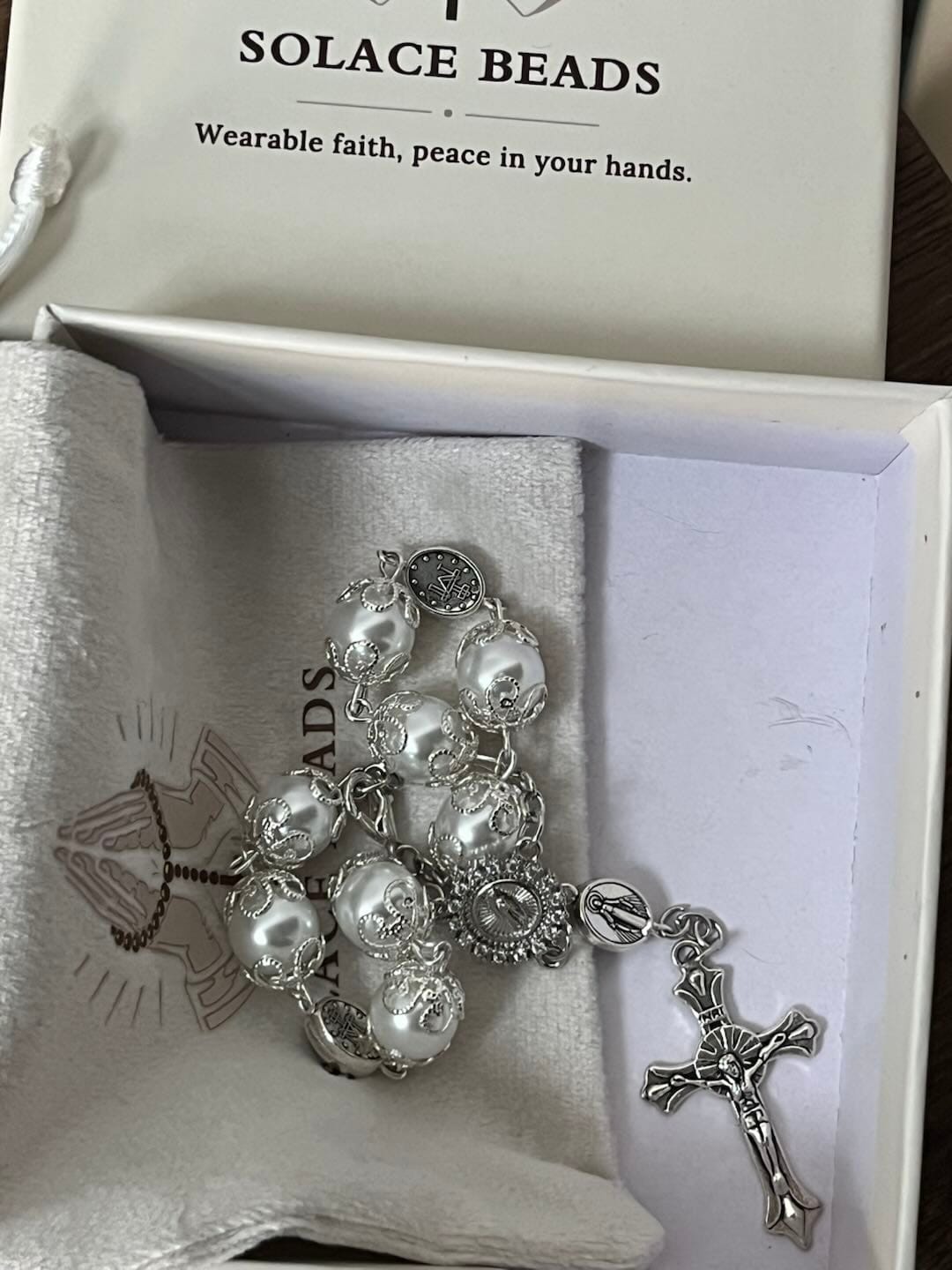 Customer photo review of SolaceBeads Handcrafted Car Rosary, White & Reddish Brown Pearl Beads with Medal & Cross: Serene Vibe