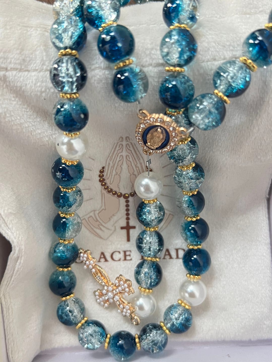 Customer photo review of SolaceBeads Gradient Ocean Crackle Glass Rosary & Pearl Embedded Cross: Rooted in Guadalupe Faith