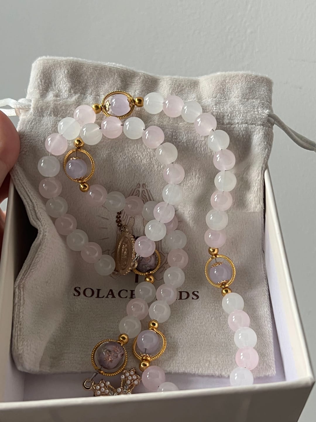 Customer photo review of SolaceBeads Artistic Pink & White Beaded Rosary: A Fusion of Colors & Sacred Symbols
