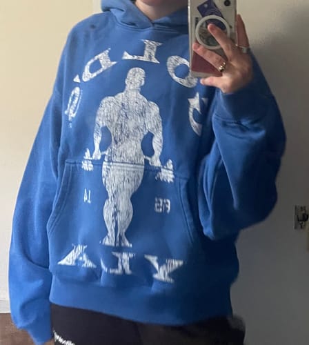 Customer's blue Gold's Gym Classic Pullover hoodie showing the distressed white graphic of a bodybuilder