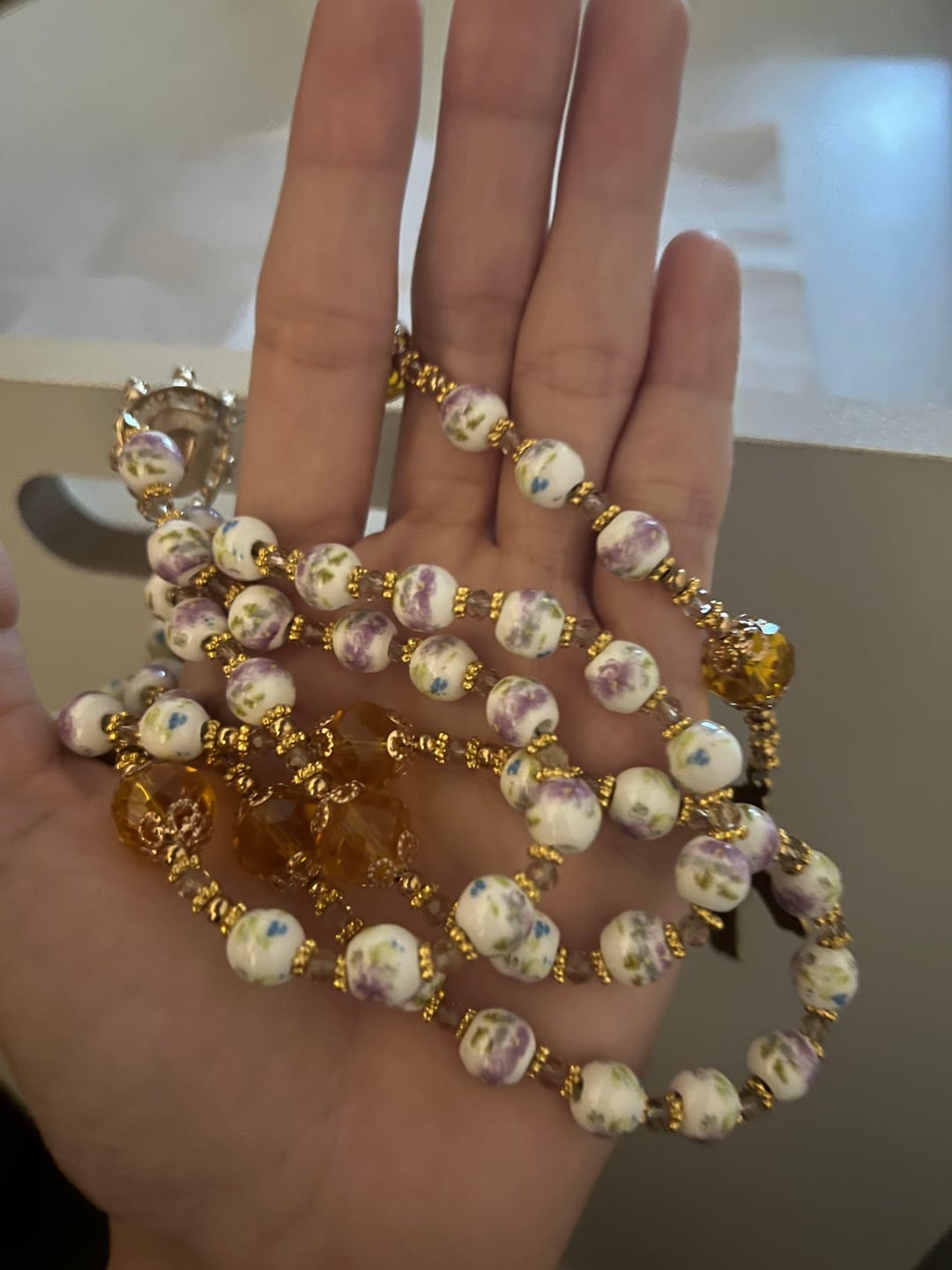 Customer photo review of SolaceBeads Lavender Floral With Golden Sacred Heart & Crucifix Rosary: Faith in Every Bead