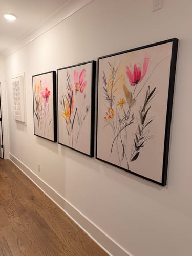 Customer's Floral Harmony set of 3 framed wall art pieces hanging together on a hallway wall.