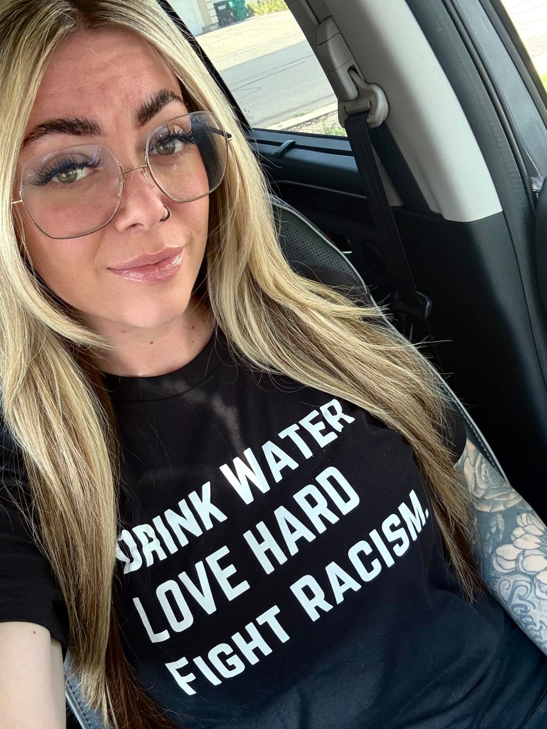 Customer photo review of Drink Water Fight Racism Unisex T-shirt