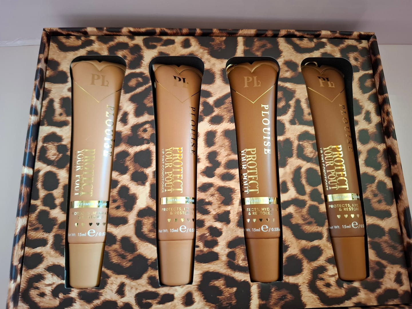 Customer photo review of Wild Instincts Cheetah Tinted Lip Conditioner Set