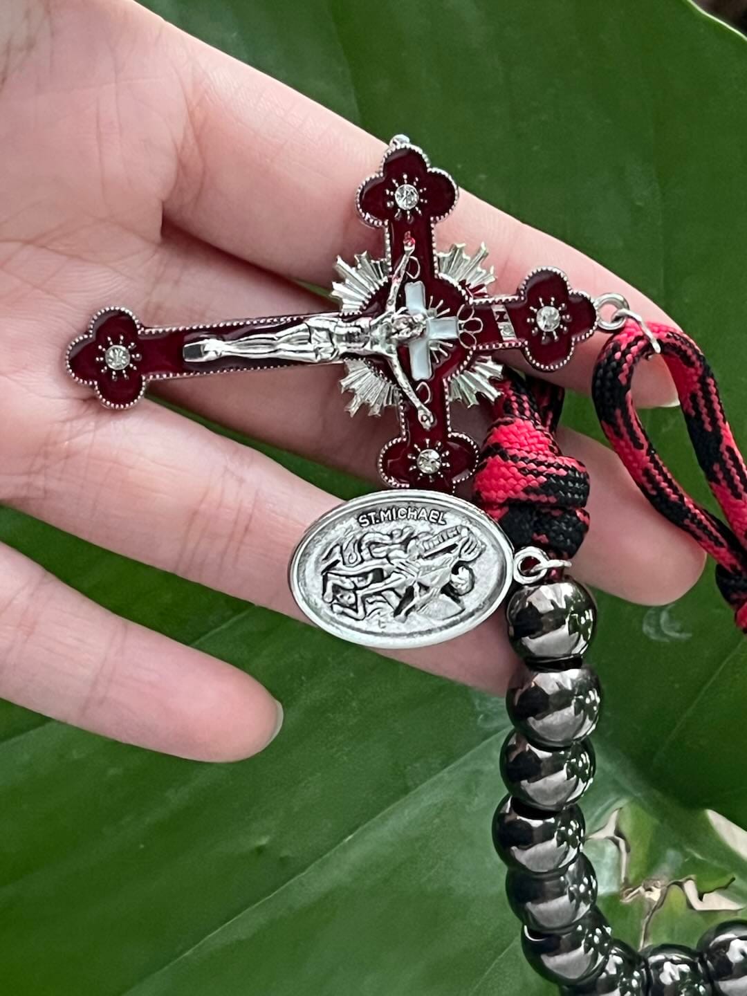 Customer photo review of Solacebeads Gunmetal Bead Car Rosary & Red Enamel Crucifix: Rooted In St. Michael Protection