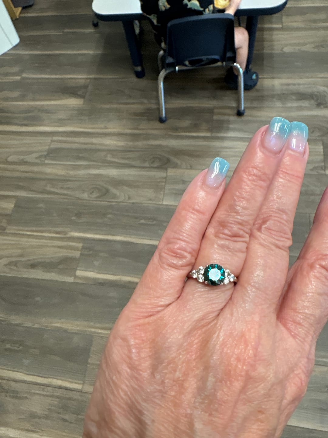 Customer photo review of Green Moissanite Side Stone Engagement Ring