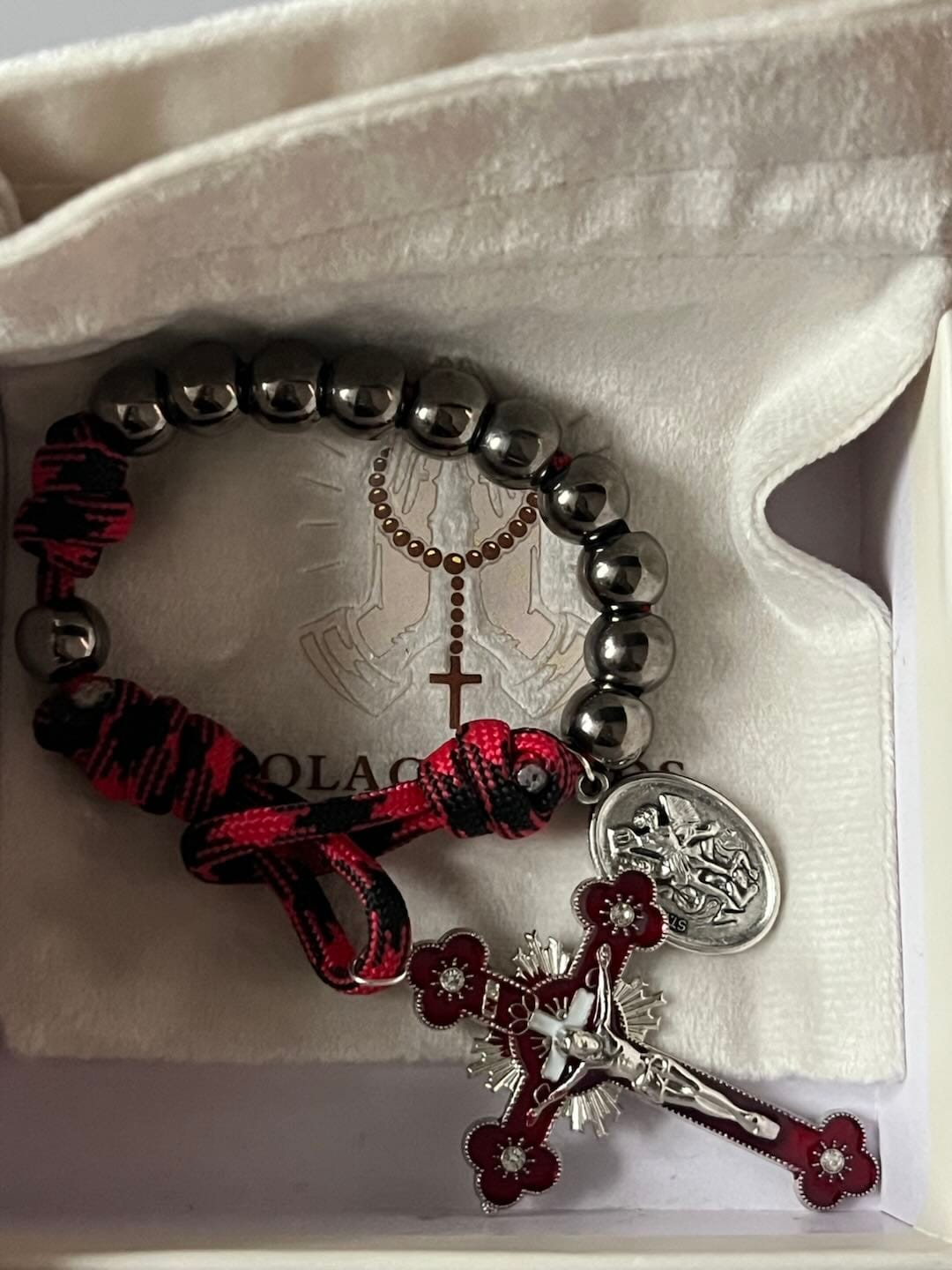 Customer photo review of Solacebeads Gunmetal Bead Car Rosary & Red Enamel Crucifix: Rooted In St. Michael Protection