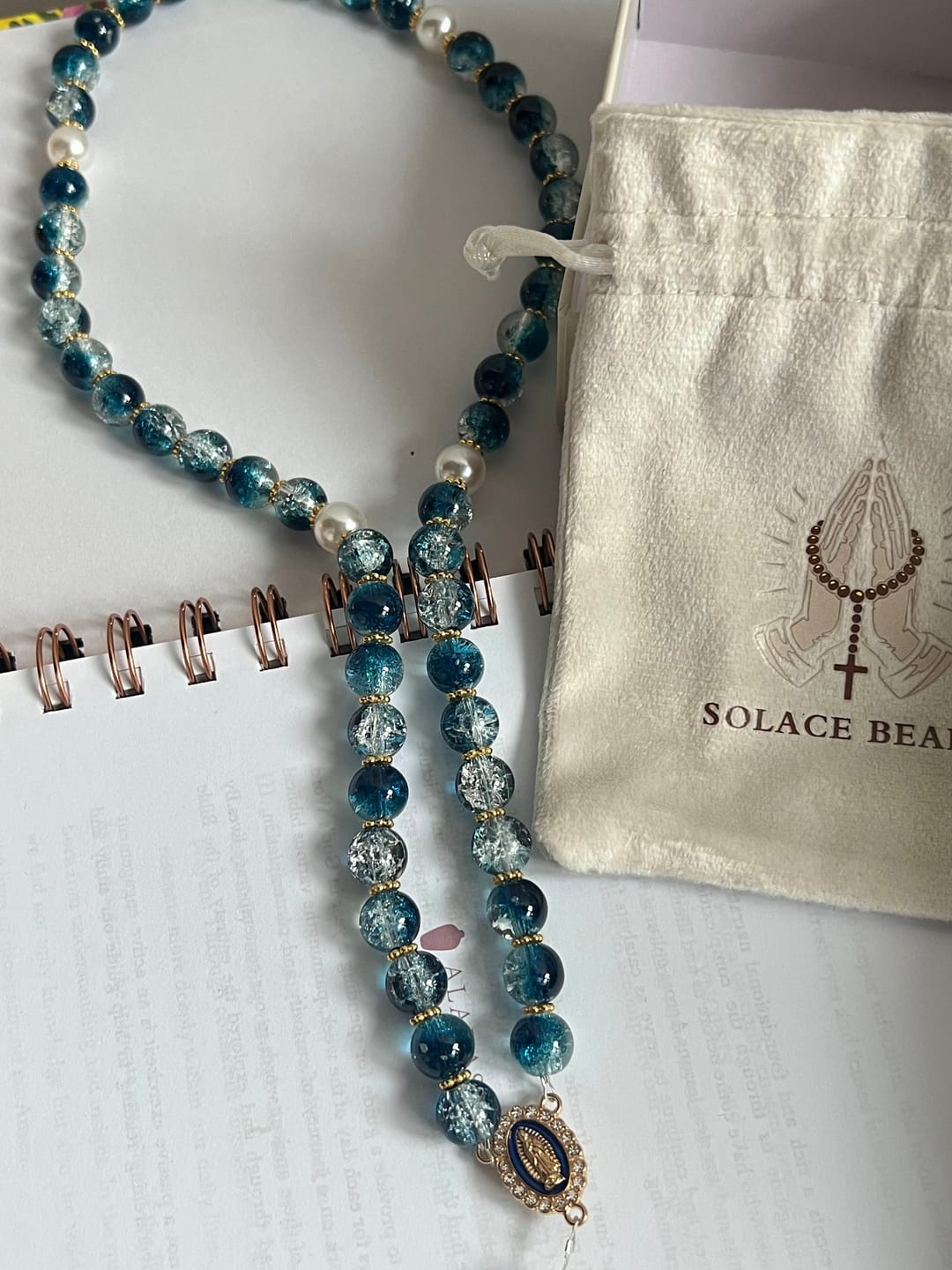 Customer photo review of SolaceBeads Gradient Ocean Crackle Glass Rosary & Pearl Embedded Cross: Rooted in Guadalupe Faith