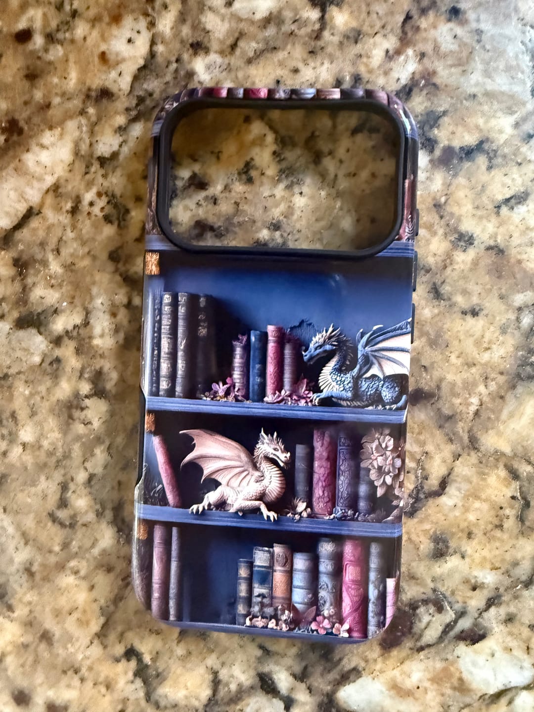 Customer photo review of The Dragon's Keep – Fantasy Bookshelf Design iPhone Case