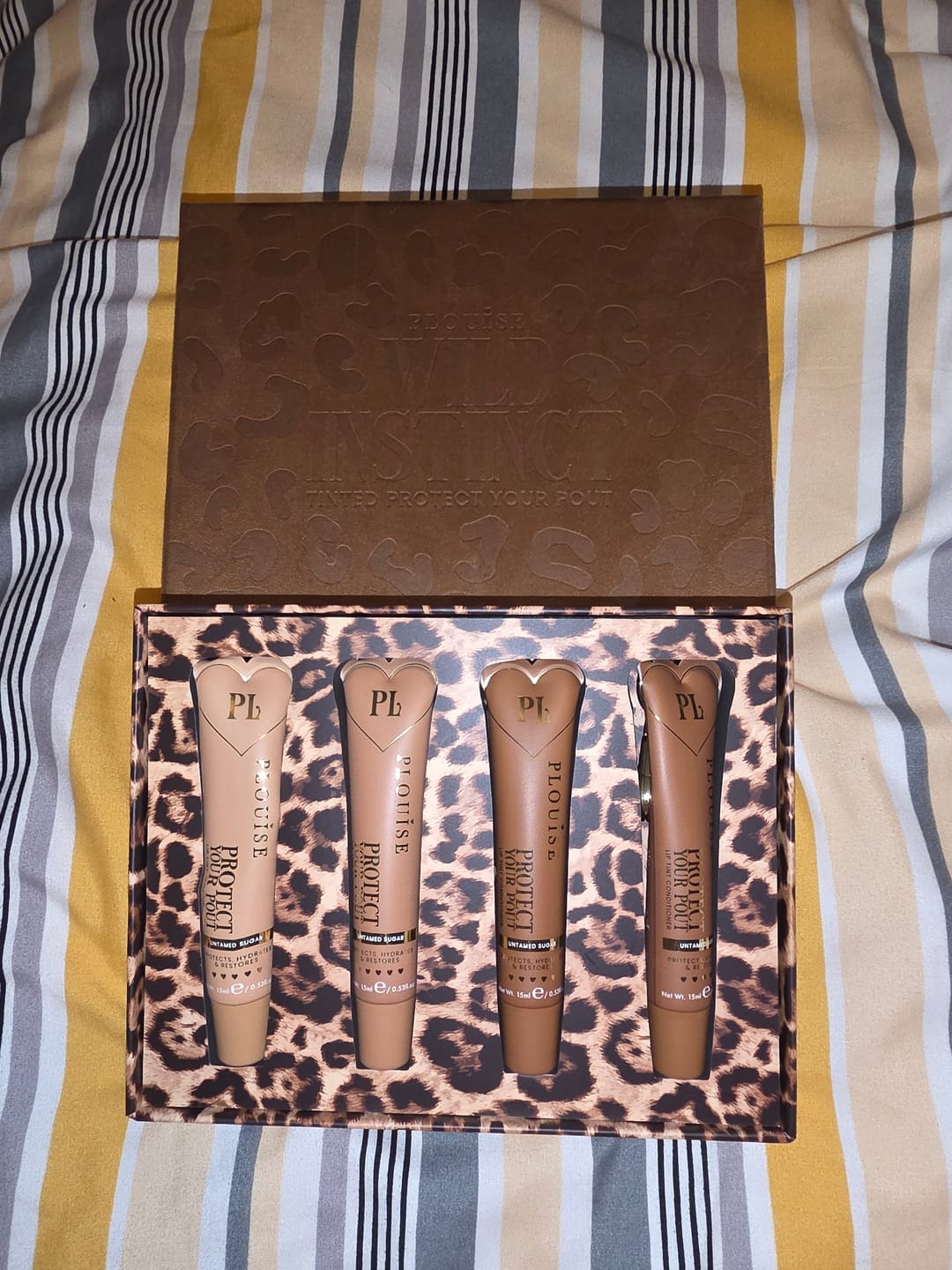 Customer photo review of Wild Instincts Cheetah Tinted Lip Conditioner Set