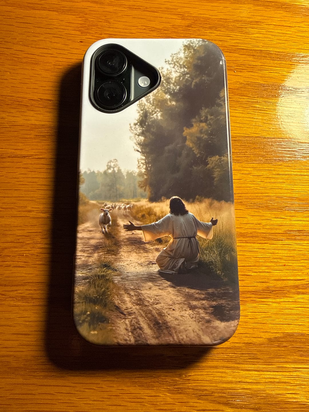 Customer photo review of Lamb Runs to Jesus Phone Case