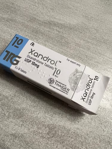 Customer's box of Thaiger Pharma Xandrol Oxandrolona tablets on a textured surface.
