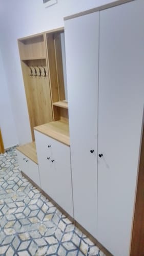 Customer's Rani P6 modern portmanto installed, featuring walnut and white finishes in a home entryway.