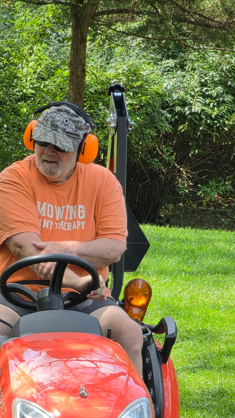 Customer photo review of Decibel Defense Safety Earmuffs in Hi-Visibility Orange