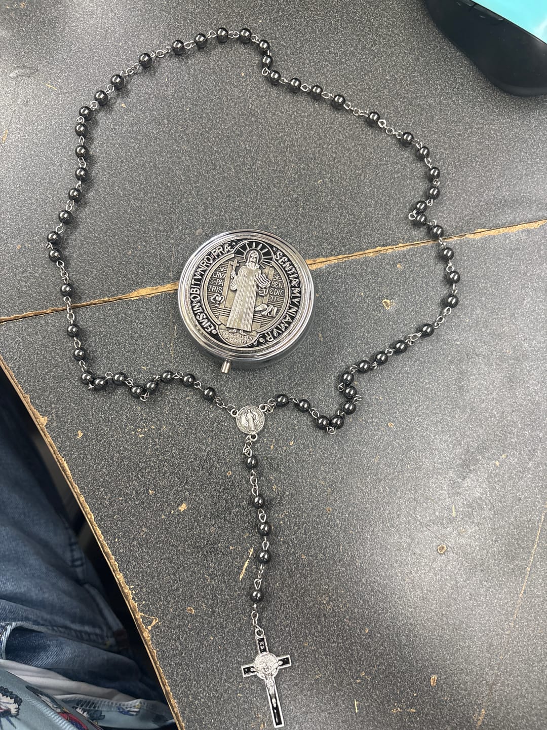 Customer photo review of FREE Today: Portable Saint Benedict Hematite Rosary With Engraved Metal Storage Case