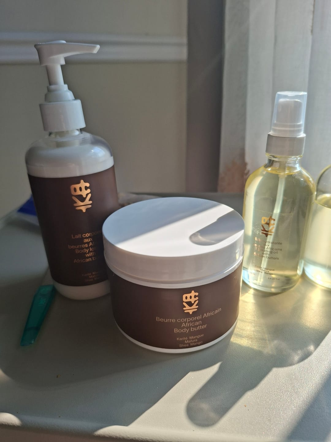Customer photo review of Lait corporel 10 oz+ beurre corporel + Huile - Trio (hydratation intense)