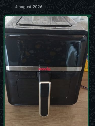 Customer's black Novio StonePro air fryer sitting on a kitchen counter.
