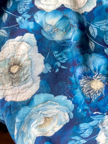 Customer's Ocean Bloom Viscose fabric featuring a floral design in vibrant blue shades.