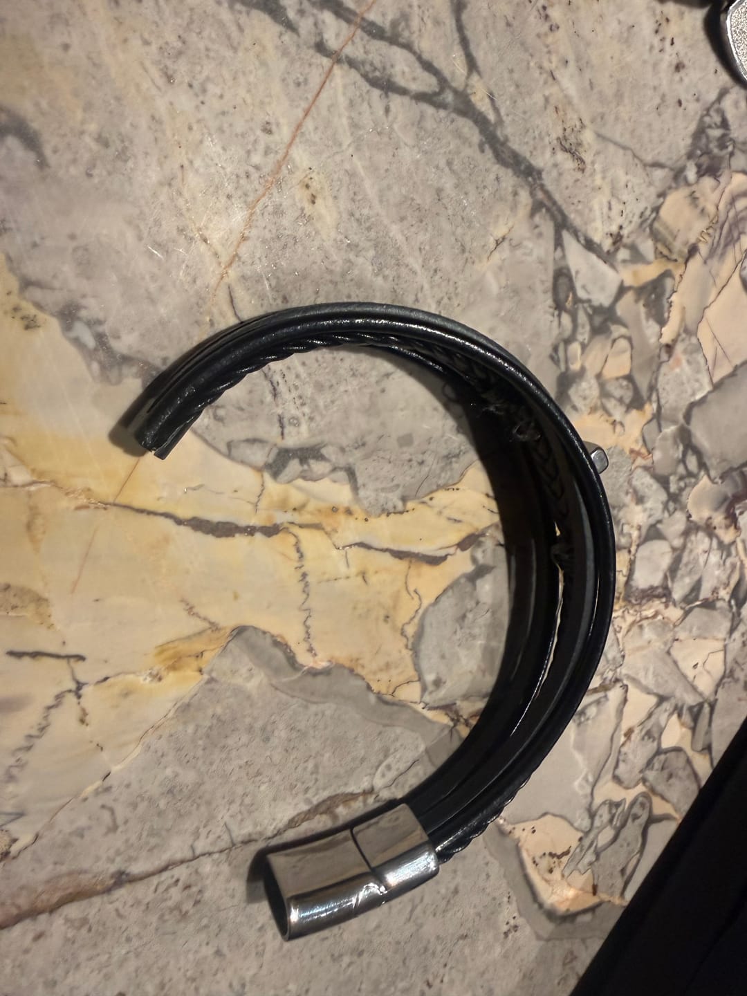 Customer photo review of Christianartworkshop Braided Cross Leather Bracelet: Steady Grace for Everyday Wrists