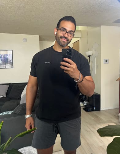 Customer's black Perfect Tailored Tee worn as a fitted top.