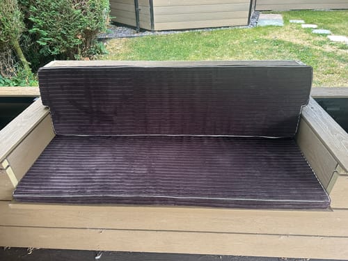 Customer's cream piping used as contrast edging on brown ribbed garden bench cushions.