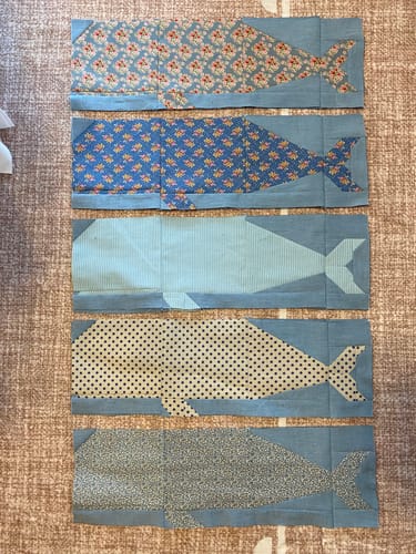 Customer's Tilda Blue Whale quilt blocks featuring whale shapes in varied patterned blue fabrics.