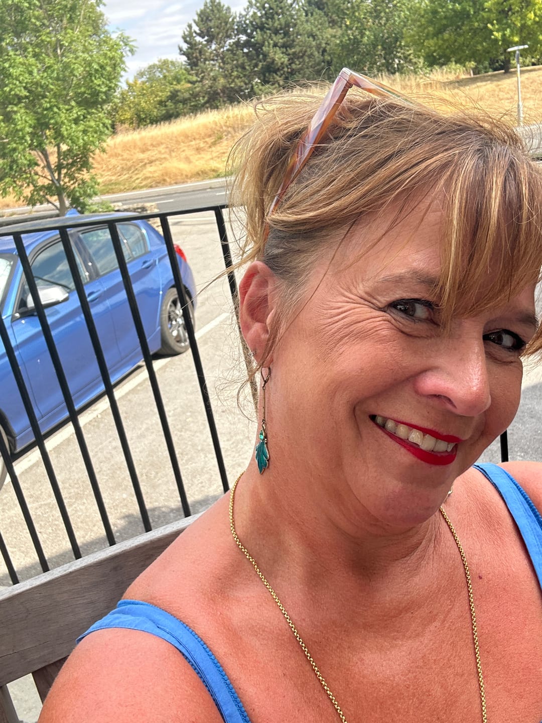 Customer photo review of Teal Peacock Drop Earrings