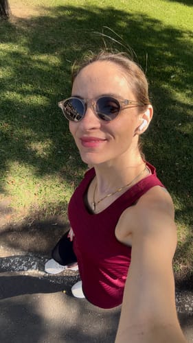 Customer's Artist sunglasses with round frames worn outdoors on a sunny day.