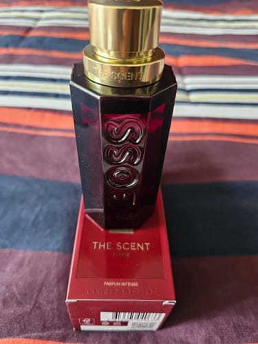 Customer's Hugo Boss The Scent Elixir perfume bottle standing upright on its red product box.