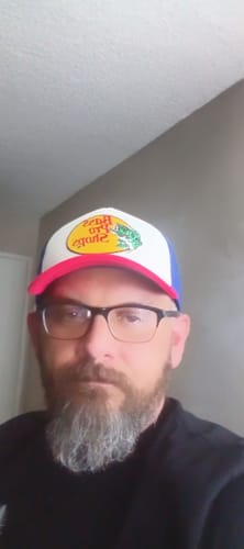 Customer's Big Foam Trucker Hat with red, white, and blue colors worn by a person with glasses.