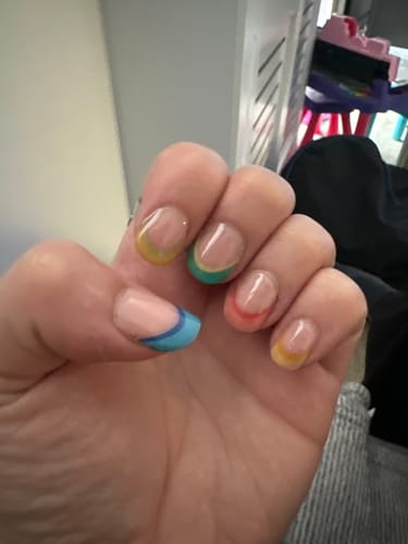 Customer's Gloss Top Coat on fingernails with colorful French-tip design