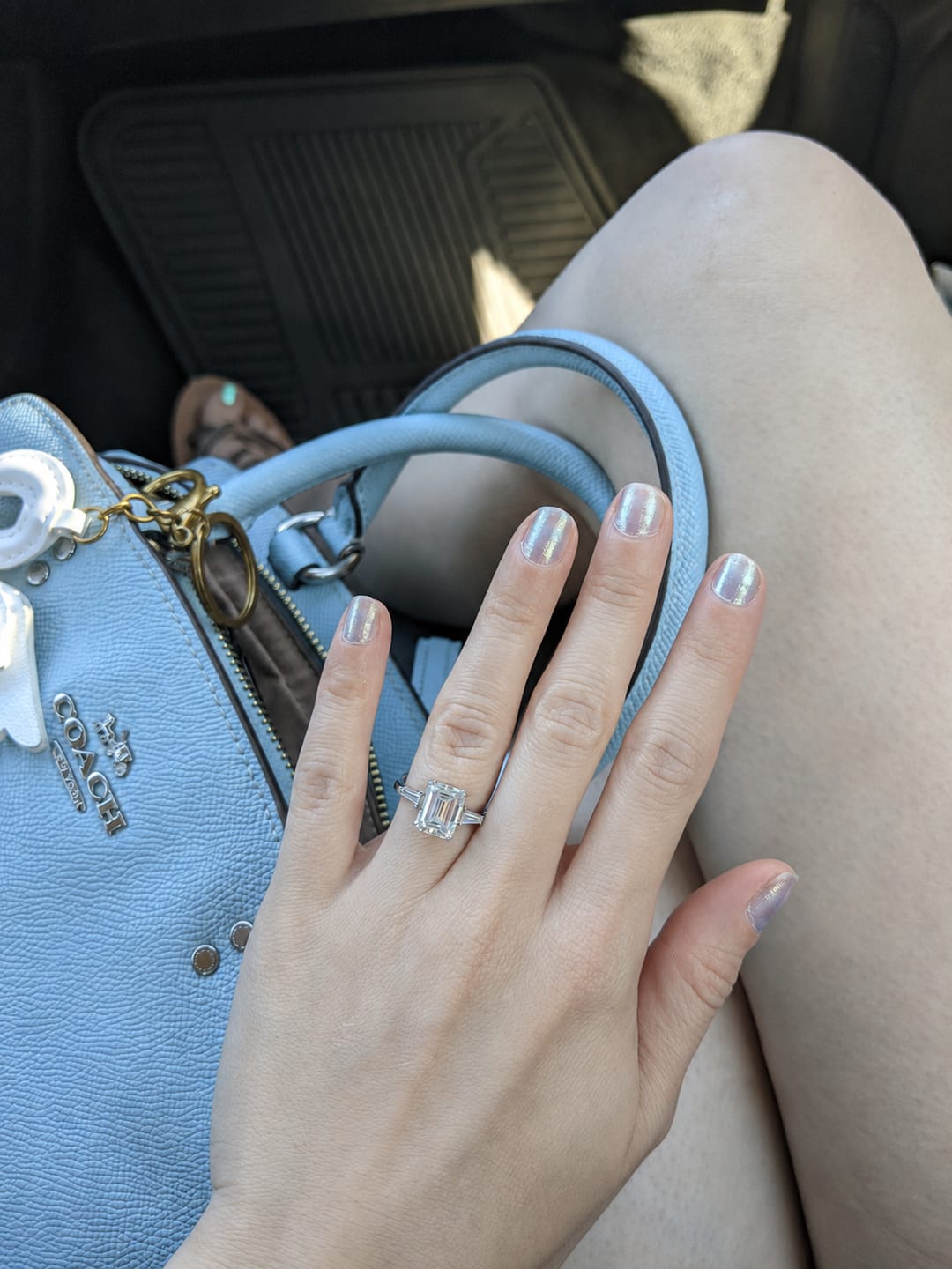 Customer photo review of Three Stone Emerald Cut Moissanite Tapered Baguette Engagement Ring