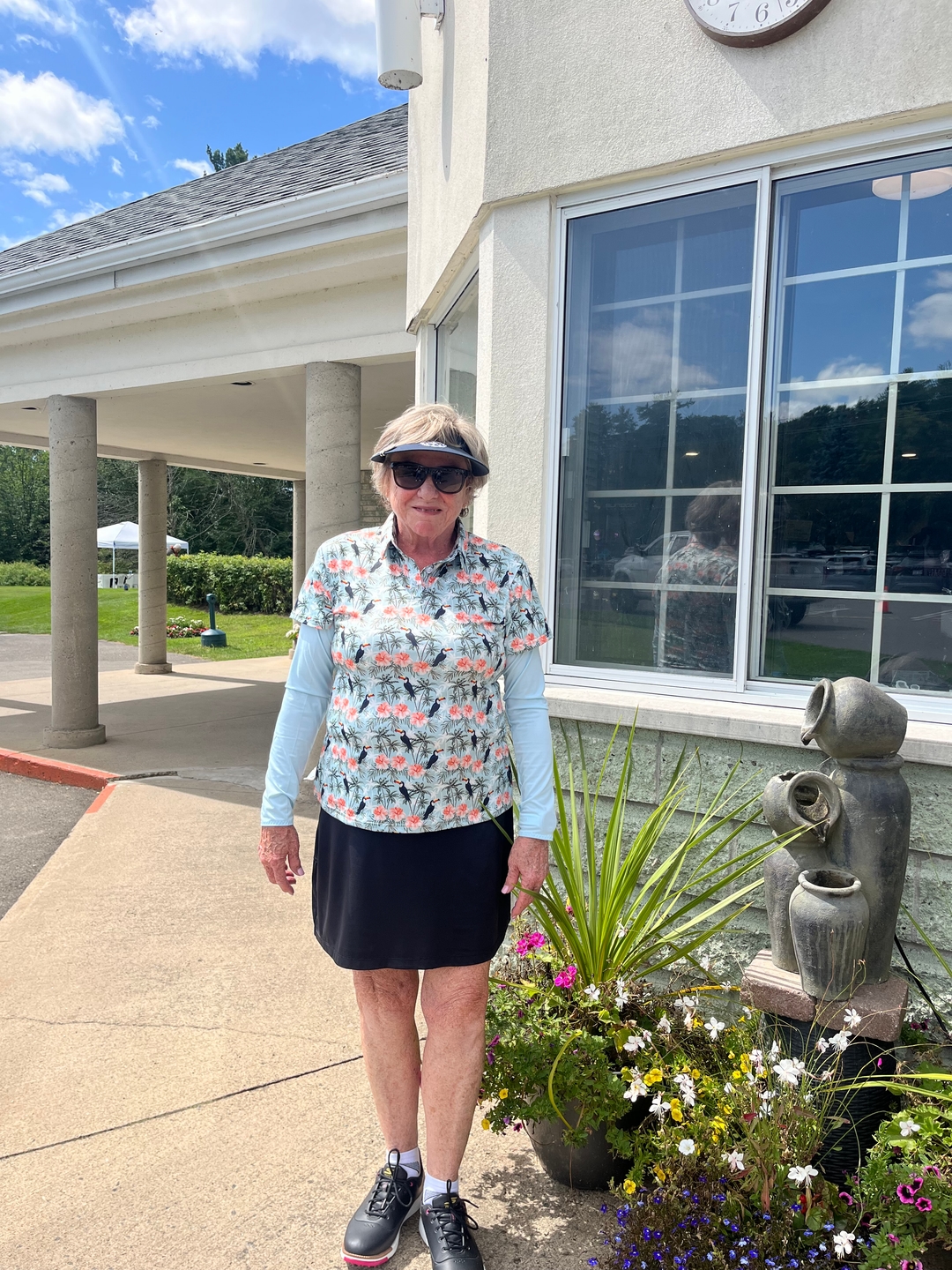 Women's Blue tropical flower flamingo Golf Polo golf outfit inspiration from Golf Gentry