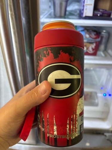 Customer's Georgia Bulldogs Frost Buddy can cooler held in hand in front of an open refrigerator