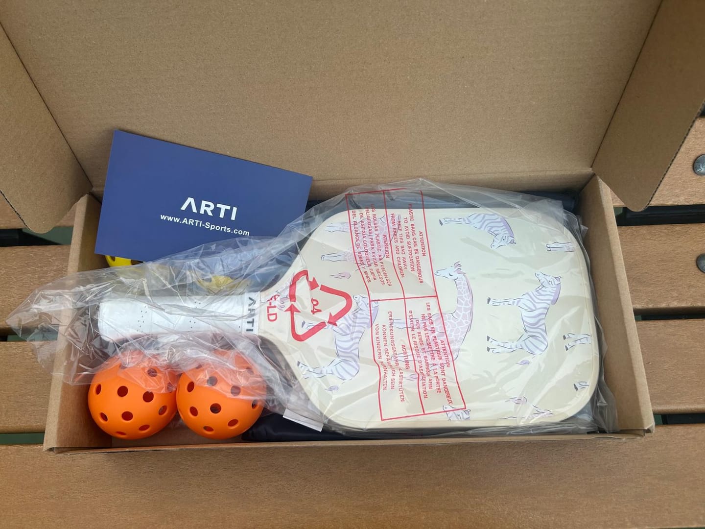 Customer photo review of ARTI Fiberglass "Dogs & Giraffes" Pickleball Paddle Set - USA Pickleball Approved