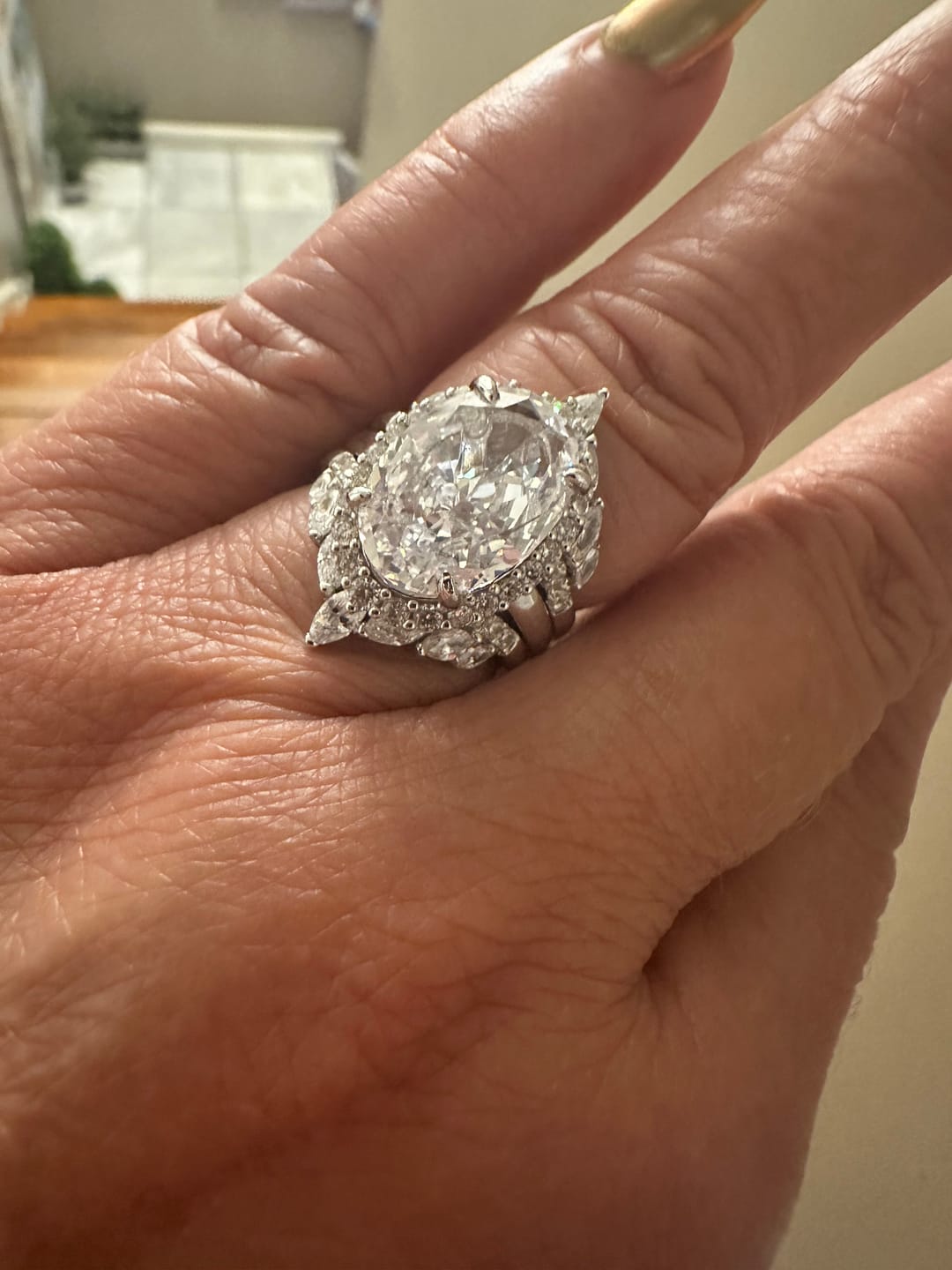 Customer photo review of Sparkling 6.0ct Oval Cut Halo 3PC Wedding Ring Set in Sterling Silver