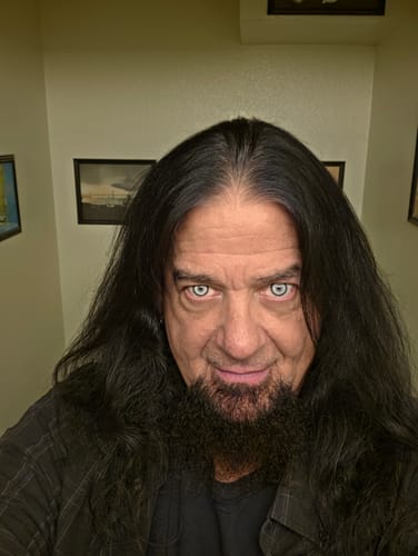 Customer's Cosplay KOI Gray Colored Contact Lenses worn, showing a striking gray effect on the reviewer's eyes.