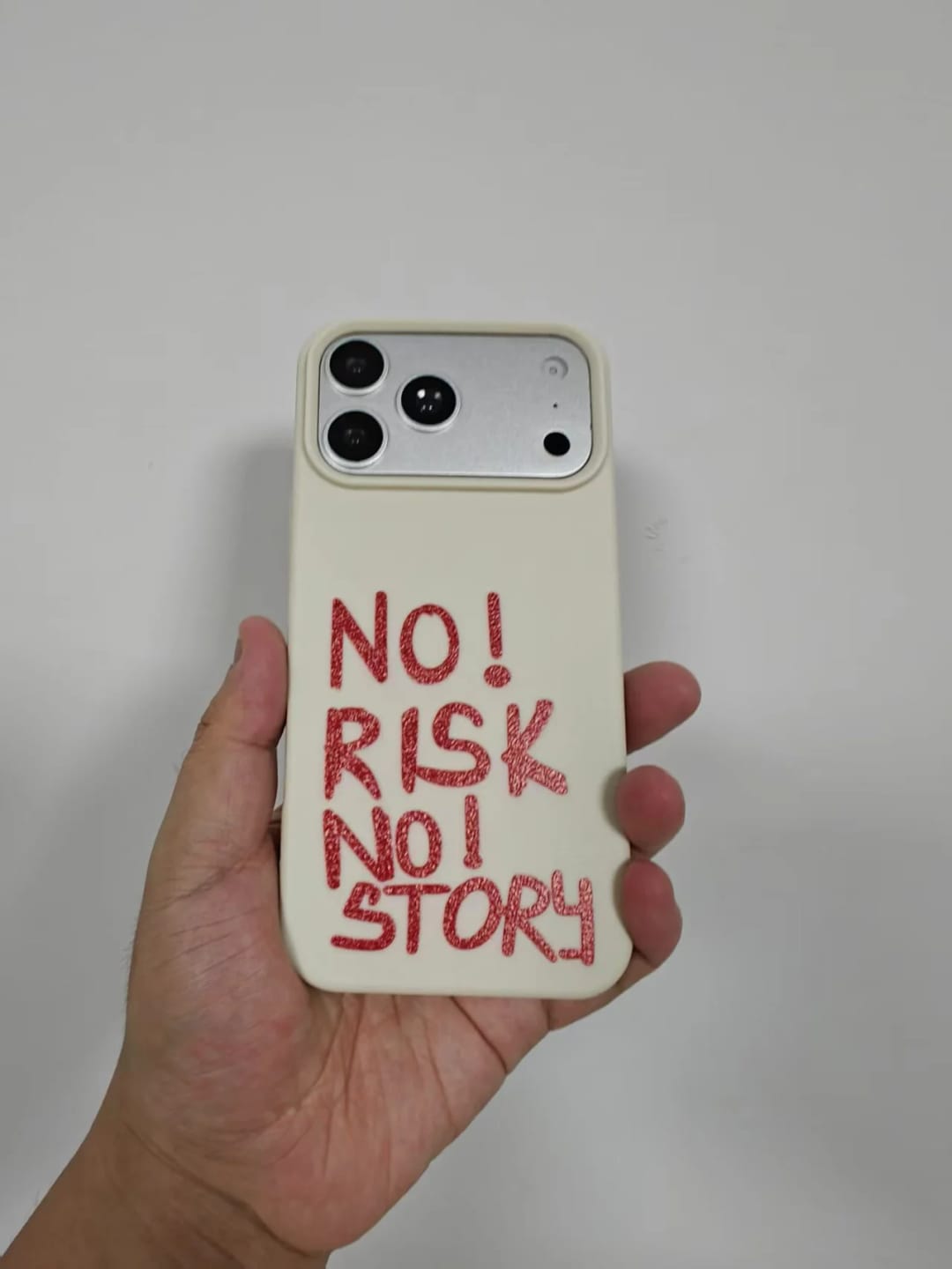 Customer photo review of 'NO RISK, NO STORY' iPhone Case