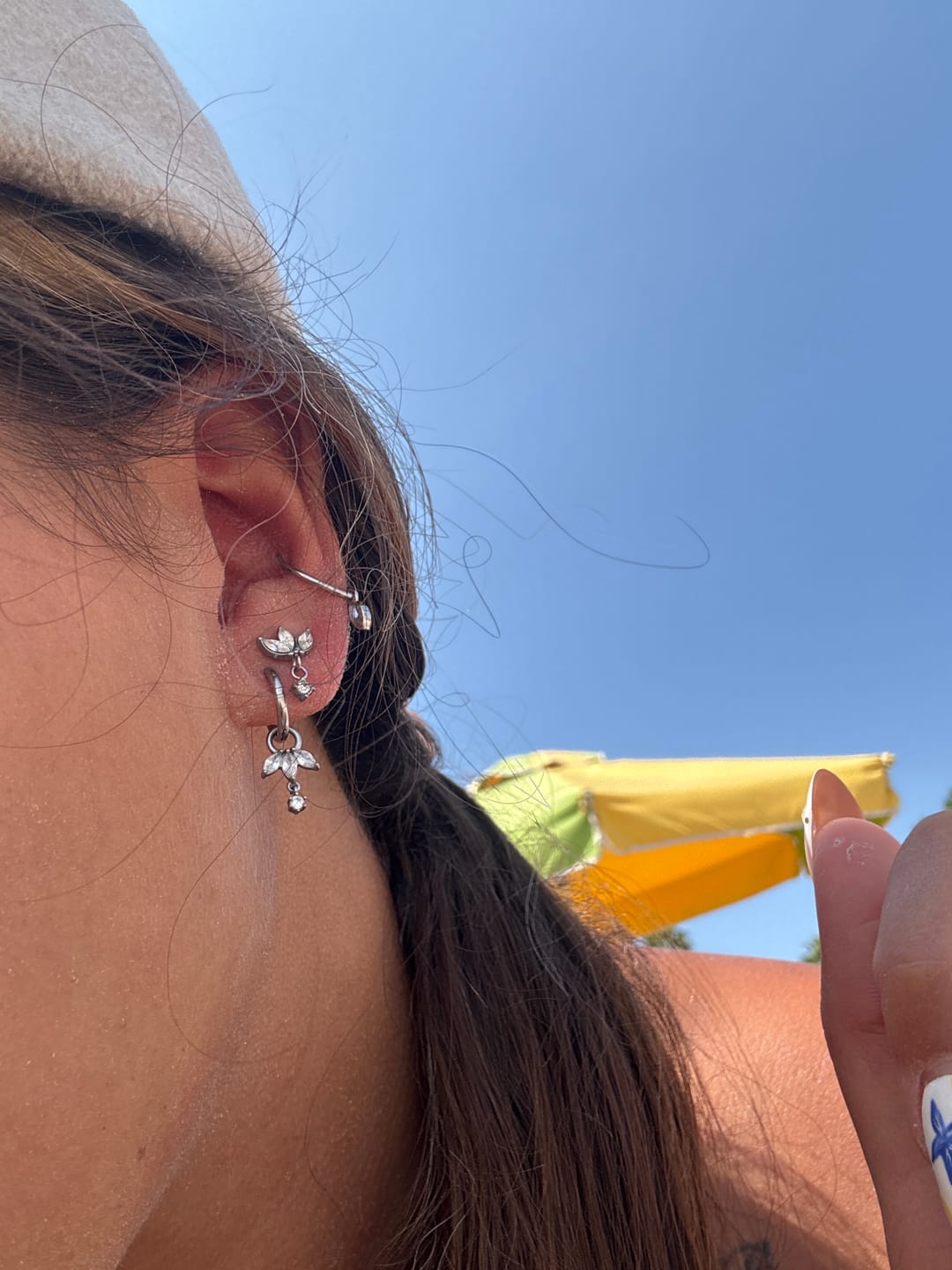 Customer photo review of Simple Lotus Huggie Ohrringe