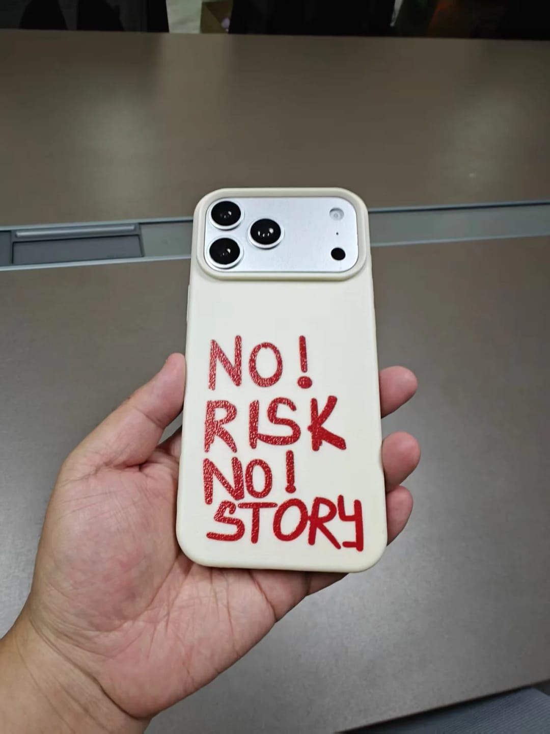 Customer photo review of 'NO RISK, NO STORY' iPhone Case