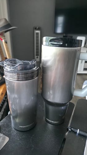 Customer's Thicc Buddy 40oz and Universal XL mug on a black surface.