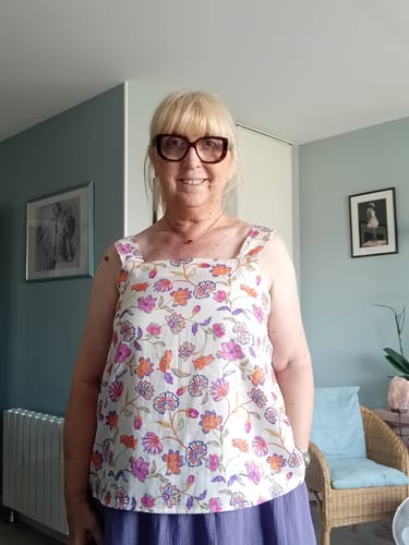 Customer's Blouse Florence worn with a long purple skirt, showing the floral print and square neckline.
