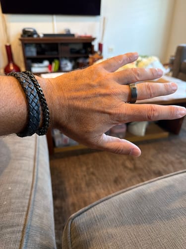 Customer's Franco Link Bracelet stacked with a leather bracelet on their wrist.