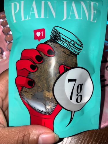 Customer's teal Bubba Kush CBD Flower pouch with a red-gloved hand illustration and a 7g label.