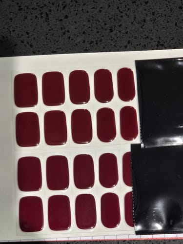 Customer's Mulled Wine Holy Gels sheet, showing many dark red, rectangular nail polish strips.
