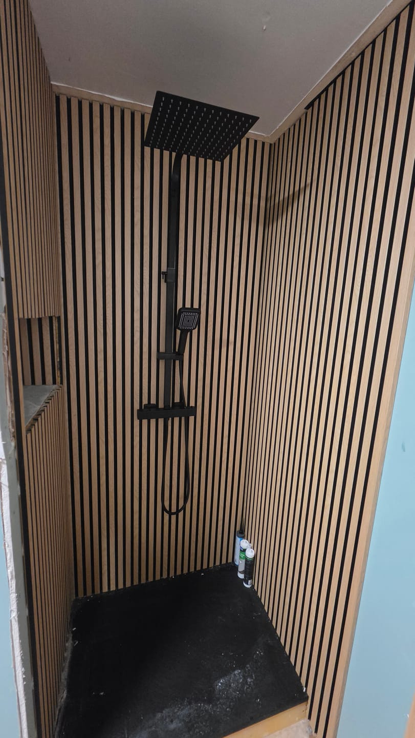Customer photo review of SlatWall Waterproof Natural Oak and Black Wall Panel