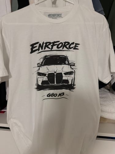 Customer's white ENR #86 Tee featuring a hand-sketched black graphic of a G80 M3 car on the front.