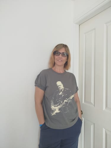 Customer's grey Churchill Rock T-Shirt featuring a graphic of Winston Churchill playing a guitar.
