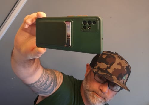 Customer's Big Flat Bill Structured Watersport Hat in a camo print, close-up on a person